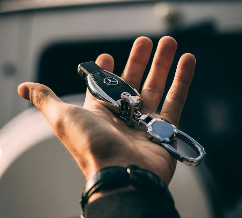 Merceded Key Fob In Mans Hand Image